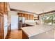 Spacious kitchen with a center island, stainless steel refrigerator, and ample cabinetry for storage solutions at 2561 Cactus Bluff Pl, Highlands Ranch, CO 80129