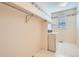 Laundry room featuring side-by-side appliances and overhead shelving at 2561 Cactus Bluff Pl, Highlands Ranch, CO 80129