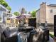 Backyard patio with stylish seating, a modern fire pit, and privacy screens, creating an inviting outdoor space at 8915 W Quarto Pl, Littleton, CO 80128