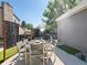 Outdoor dining area with seating for six, privacy screens, and a cozy patio setup for delightful meals at 8915 W Quarto Pl, Littleton, CO 80128