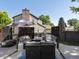 Backyard patio with comfortable seating, a fire pit, and decorative privacy screens, perfect for outdoor relaxation at 8915 W Quarto Pl, Littleton, CO 80128