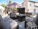 Charming backyard patio with comfortable seating and a modern fire pit, ideal for outdoor gatherings and relaxation at 8915 W Quarto Pl, Littleton, CO 80128