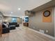 Large finished basement with comfortable seating area and entertainment space at 8915 W Quarto Pl, Littleton, CO 80128