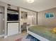 Bedroom featuring a functional desk space, ideal for a home office or study area at 8915 W Quarto Pl, Littleton, CO 80128
