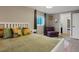 Inviting bedroom with ample natural light and a comfortable seating area for relaxation at 8915 W Quarto Pl, Littleton, CO 80128
