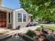 Inviting front porch with cozy seating area, vibrant plants, and stylish decor for relaxing outdoors at 8915 W Quarto Pl, Littleton, CO 80128