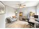 Comfortable home office with ceiling fan, modern furniture, and wood-look floors at 8915 W Quarto Pl, Littleton, CO 80128