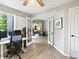 Well-lit home office with French doors opening to other living spaces at 8915 W Quarto Pl, Littleton, CO 80128