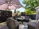 Inviting patio with comfortable seating, modern privacy screens, and a cozy fire pit for outdoor relaxation at 8915 W Quarto Pl, Littleton, CO 80128