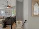 Contemporary staircase leads to living room with modern furnishings at 8915 W Quarto Pl, Littleton, CO 80128