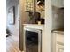 Corner of room showing the coffee and wine bar with wine fridge at 8915 W Quarto Pl, Littleton, CO 80128