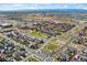 Aerial view of a residential neighborhood showcasing homes and landscaping at 7932 E 49Th Pl, Denver, CO 80238