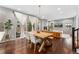 Bright dining room with a farmhouse table and kitchen access at 7932 E 49Th Pl, Denver, CO 80238