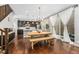 Modern dining area with a farmhouse table near the kitchen at 7932 E 49Th Pl, Denver, CO 80238