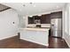 Modern kitchen with stainless steel appliances and island at 7932 E 49Th Pl, Denver, CO 80238