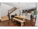 Modern kitchen with dark cabinetry, stainless steel appliances, and an island at 7932 E 49Th Pl, Denver, CO 80238