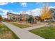 Community playground with walkway and trees at 7932 E 49Th Pl, Denver, CO 80238