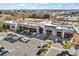 Aerial view of shopping center with various stores and parking at 7932 E 49Th Pl, Denver, CO 80238