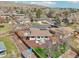 Backyard featuring a well-manicured lawn, privacy fence, patio, and shed; perfect for outdoor activities at 2085 S Deframe St, Lakewood, CO 80228