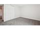 Unfurnished room with neutral carpet, white closet door and ample natural light at 2085 S Deframe St, Lakewood, CO 80228