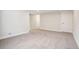 Large finished basement with neutral carpet, white trim, and ample space at 2085 S Deframe St, Lakewood, CO 80228