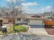 Exterior features a well-manicured lawn, driveway, and two-car garage at 2085 S Deframe St, Lakewood, CO 80228