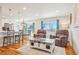 Bright and airy living room with hardwood floors, comfortable seating, and ample natural light at 2085 S Deframe St, Lakewood, CO 80228