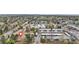 High angle aerial view of townhome showing its location among lush trees and convenient parking at 7110 S Gaylord St # O7, Centennial, CO 80122