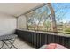 Cozy balcony with a small table, perfect for enjoying a morning coffee or evening relaxation overlooking the outdoors at 7110 S Gaylord St # O7, Centennial, CO 80122