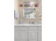 Bathroom featuring a white vanity with sink and a large mirror above at 7110 S Gaylord St # O7, Centennial, CO 80122
