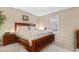 Comfortable bedroom featuring wood accents and a bright window at 7110 S Gaylord St # O7, Centennial, CO 80122