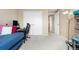 Bedroom with a chair and desk and two large closets at 7110 S Gaylord St # O7, Centennial, CO 80122