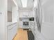 Kitchen featuring modern appliances, updated cabinetry, and stylish backsplash at 7110 S Gaylord St # O7, Centennial, CO 80122