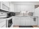 Well-lit kitchen showcasing stainless steel appliances and modern finishes at 7110 S Gaylord St # O7, Centennial, CO 80122