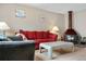 Cozy living room with a fireplace, comfortable seating, and lots of natural light at 7110 S Gaylord St # O7, Centennial, CO 80122