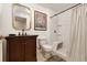 Traditional bathroom features granite vanity, framed mirror and shower with built in bench at 18489 E Columbia Cir, Aurora, CO 80013