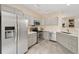 Bright kitchen features stainless steel appliances, light gray cabinetry, and stone countertops at 18489 E Columbia Cir, Aurora, CO 80013