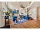 Bright living room featuring vaulted ceilings, a fireplace, hardwood floors, and tasteful furnishings at 18489 E Columbia Cir, Aurora, CO 80013