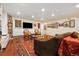 Cozy living room featuring a sofa, chairs, and plenty of custom storage at 18489 E Columbia Cir, Aurora, CO 80013