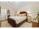 Primary bedroom features hardwood floors, chandelier, and ensuite bathroom at 18489 E Columbia Cir, Aurora, CO 80013