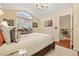 Spacious main bedroom featuring a vaulted ceiling, chandelier and bright natural light at 18489 E Columbia Cir, Aurora, CO 80013