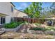 Beautiful backyard featuring garden beds and a stone pathway, perfect for gardening and outdoor enjoyment at 2390 N Springwood Ct, Lafayette, CO 80026