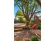 Inviting backyard with a swing, patio, and deck creating a cozy outdoor space for relaxation and enjoyment at 2390 N Springwood Ct, Lafayette, CO 80026