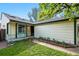 Charming home exterior with a well-maintained lawn, garden, and welcoming front porch seating at 2390 N Springwood Ct, Lafayette, CO 80026