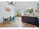 Well-lit kitchen with dark cabinets, wood counters, and stainless appliances, offers seamless outdoor patio access at 2390 N Springwood Ct, Lafayette, CO 80026