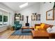 Bright living room with vaulted ceilings, skylight, hardwood floors and contemporary furnishings at 2390 N Springwood Ct, Lafayette, CO 80026