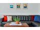 Close up of the leather sectional with an aloe plant on a wood block coffee table in the living room at 2390 N Springwood Ct, Lafayette, CO 80026