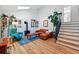 Spacious living room with hardwood floors, comfortable seating, and lots of natural light at 2390 N Springwood Ct, Lafayette, CO 80026