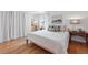 Cozy bedroom with neutral decor, ample natural light, and hardwood flooring at 2390 N Springwood Ct, Lafayette, CO 80026