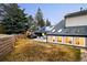 Expansive backyard with stone retaining wall, patio, solar panels, and hot tub provides ample outdoor living at 3970 Longwood Ave, Boulder, CO 80305